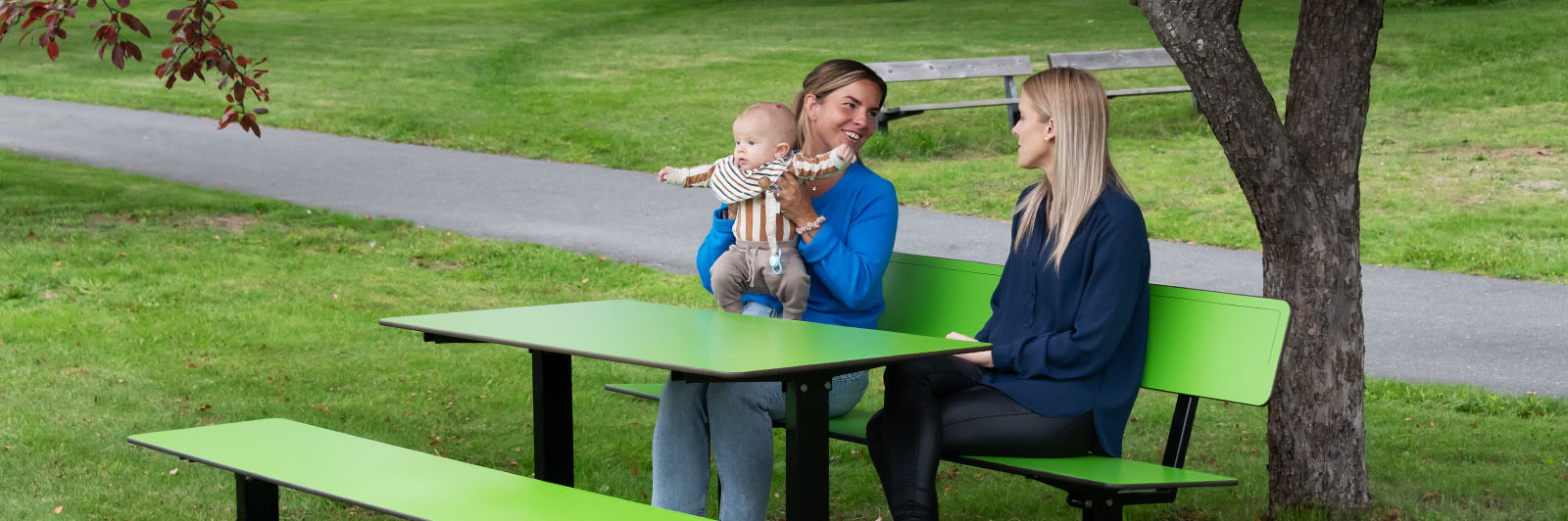 Friends hanging out in local park on HPL furniture